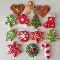 decorated christmas cookies arranged in different shapes and sizes