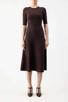 The Seymore Dress is in cashmere wool and silk blend with a crew neckline, A-line silhouette, and elbow sleeves. It is completed with a full midi-length skirt.Details:90% Merino Wool, 10% CashmereInternational sizingMade from Italian yarnsSize and Fit: Fits true to size. Model is 5'11"" and wearing a size S. Poncho Cardigan, Cape Sweater, Suede Tops, Gabriela Hearst, Satin Bags, Yarn Sizes, Midi Length Skirts, Silk Wool, Knitwear Tops