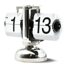 an alarm clock with the time 11 13 on it's face and numbers displayed