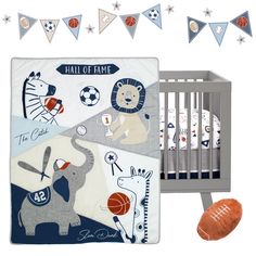 a baby crib bedding set with sports themed sheets and pillows, along with an orange football