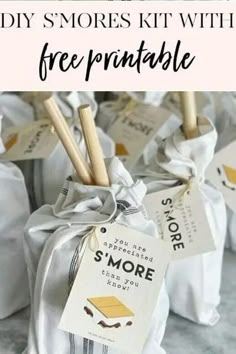 some small bags filled with smores and the words, diy s'mores kit with free printable