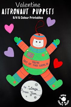 valentine's day craft for kids to make an astronaut puppett with paper hearts