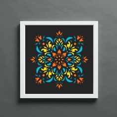 a colorful flower design on a black background in a white frame with an orange and blue border