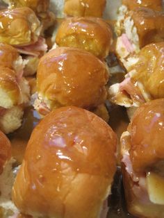 close up view of some kind of bread with meat and cheese on it, sitting in a pile