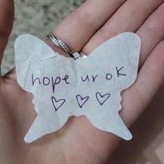 a hand holding a piece of paper with writing on it that says hope ur ok