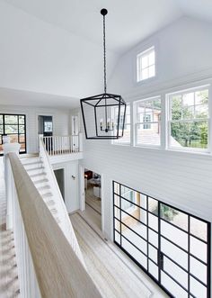 the inside of a house with white walls and wood floors is shown on instagram