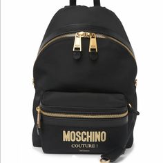 Moschino Logo Print Nylon Backpack Gold Letters New Black. Top Carry Loop - Adjustable Shoulder Straps - Zip-Around Closure - Exterior Features Gold-Tone Hardware And Logo Print With Front Zip Pocket - Interior With Main Compartment - Moschino Letters Printed On Shoulder Strap With Dust Bag Luxury Backpack With Logo Hardware For Everyday Use, Luxury Backpack For Everyday Use With Logo Hardware, Black Travel Backpack With Logo Hardware, Luxury School Bags With Logo, Luxury School Backpack With Logo, Designer Black Nylon Backpack, Designer Nylon School Bags, Moschino Backpack, Velvet Backpack