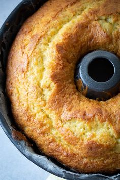 a bundt cake in a pan with a black ring on the top and bottom