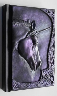 a metal plaque with a horse on it