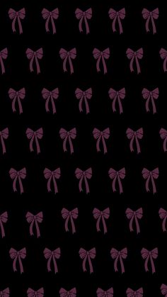 a black background with purple bows on it