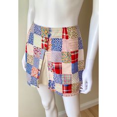 Adorable late 60s / early 1970s mini skort. Colorful patchwork print with plaids & calico. It has gold buttons (non functional) , it's split in the front showing the attached white shorts. Zips up the back. Thick poly/cotton blend material In excellent condition SIZE : no size tag, fits like an Xs Measurements : Waist 26 HIPS : up to 40 LENGTH : 13 INSEAM : 2.75 I aim to provide accurate descriptions and measurements. To best determine size, compare measurements to a similar garment you own that Retro Cotton Skort, Retro Plaid Mini Skirt For Summer, Retro Cotton Mini Skort, Retro Cotton Patchwork Shorts, Retro Cotton Skort In Short Length, Retro Patchwork Cotton Shorts, Cotton Retro Skort, Retro Multicolor Cotton Skort, Multicolor Mini-length Cotton Skort