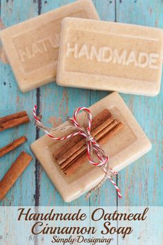 homemade oatmeal cinnamon soap on a blue wooden table with cinnamon sticks and twine