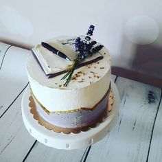 a white cake sitting on top of a wooden table