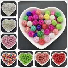 heart shaped bowl filled with lots of different colored beads