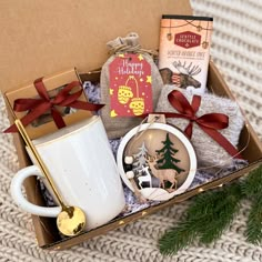 a christmas gift box with coffee, cookies and other items