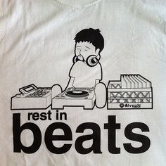 a t - shirt that says rest in beats with a cartoon character playing the record player