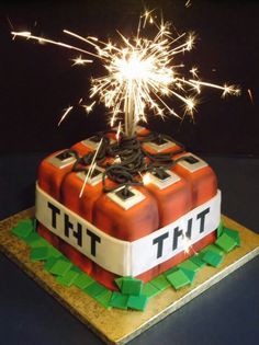 a cake that has been decorated to look like a firecracker with sparklers on top