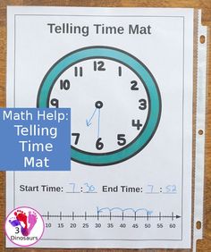 the telling time mat is on top of a wooden table