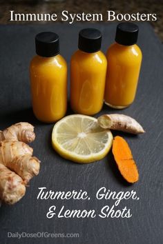 three bottles of ginger, lemon and orange juice on a slate board with the words turment ginger & lemon shots