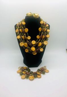 Fabulous vintage multi strand Lucite and acrylic bib necklace, bracelet and earrings demi. Necklace features 5 strands of Lucite and acrylic baroque disc like beads in fall colors and 4 strands of chains. Matching bracelet has 7 strands total. Large statement set !! The necklace measures 2 1/2 inches wide when laid flat and 18 inches long. Has secure hook clasp. Bracelet is 1 3/4 inches wide laid flat and is 7 1/2 inches long with secure fold over clasp. The matching clip back earrings are 1 1/4 Interchangeable Earrings, 1960s Jewelry, Vintage Designer Jewelry, Vintage Fine Jewelry, Bib Necklace, Matching Bracelets, Set Vintage, Gorgeous Necklaces, Multi Strand