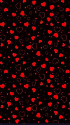 red hearts on black background for valentine's day greeting card or wallpaper design