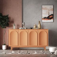 a living room with an orange cabinet and white vases on the floor next to it