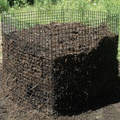 a large pile of dirt sitting in the middle of a field