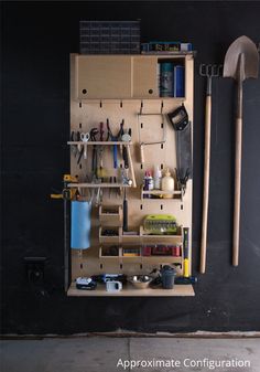 a tool rack with tools hanging on the wall next to a hammer and other items