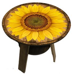 a wooden table with a sunflower painted on it