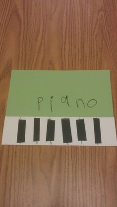 a piece of paper with the word piano written on it