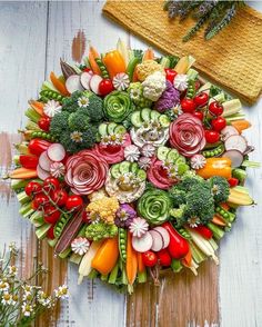 a bunch of vegetables are arranged in the shape of a circle on a wooden surface