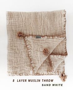 an image of a piece of cloth with the words 8 layer muslim throw