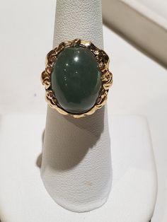 You are viewing a beautiful 14k mings green translucent jade cabochon ring. The total weight of the ring is approx.8.6 grams. The ring size approx.5 3/4 can size up or down. The ring itself measures approx.21mm x 19mm wide. Beautiful green jade translucent cabochon. Send me a message if you have any question. MAKE AN OFFER Yellow Gold Jade Cabochon Ring, Green Oval Cabochon 14k Stamped Jewelry, 14k Gold Green Gemstone Dome Ring, Formal Yellow Gold Jade Ring, Formal Green 14k Gold Dome Ring, Green Emerald Oval Cabochon Ring Stamped 14k, Gold Jade Cabochon Rings, Gold Rings With Jade Cabochon, Formal Green Opal Ring In 14k Gold