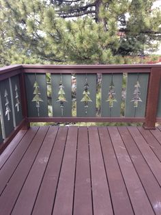 a wooden deck with pine trees painted on it