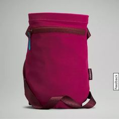 an image of a pink bag on a gray background