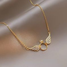 ✨ Elevate your style with this stunning Silver 925 necklace, featuring delicate wing accents and shimmering crystals. Perfect for adding a touch of elegance to any look. 💫 Adorn yourself with timeless beauty. 💖 #Shivanshri #Silver925 #MinimalistElegance #WingedBeauty #JewelryLovers #SparkleAndShine Instagram Niche, Collarbone Necklace, Small Wing, 18k Gold Necklace, Round Pendant Necklace, Circle Pendant Necklace, Circle Pendant, Round Pendant, Luhan