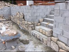 the stairs are made out of concrete blocks and cement bricks, which have been placed on top of each other