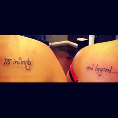 two women with tattoos on their backs saying, to infinity and beyond the words are in cursive font