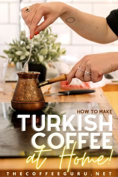 a woman is using a knife to cut coffee into small cups on a table with the words how to make turkish coffee at home