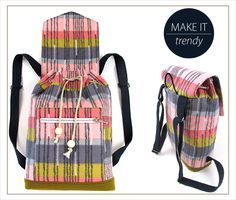 a plaid backpack is shown with the words make it trendy