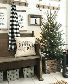 a christmas tree sitting next to a wooden bench