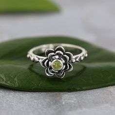 TITLE: -  Flower Ring, Natural Peridot Ring, 925 Sterling Silver Jewelry, Rose Ring, Wildflower Ring, Minimalist Jewelry Boho Ring, Vintage Style Ring SPECIFICATIONS: - ❖ Metal:  925 Solid sterling silver ❖ Gemstone:  Peridot ❖ Gemstone Size: 3mm  ❖ Total Weight: 3.7 Gram ❖ Gemstone Setting:  Bezel Note: Our use of natural stones may result in slight variations in texture and color in the actual product you receive, but the quality and grade of the stone remain consistent. FEATURES: -  * This ex Green Flower Ring With Birthstone, Elegant Green Flower Ring In Sterling Silver, Green Stone Ring For Women, Green Sterling Silver Flower Ring, Adjustable Silver Flower Ring With Gemstone, Sterling Silver Flower Rings, Nature-inspired, Ring Green Stone, Gemstone Setting, Green Stone Ring