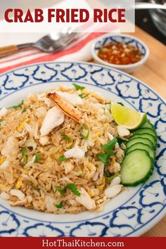 a plate with rice, cucumber and shrimp on it