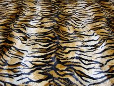 an animal print pattern is shown on the surface of a bed sheet that has been made to look like a tiger stripe