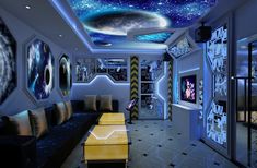 the interior of a futuristic home with artwork on the walls and ceiling, as well as couches