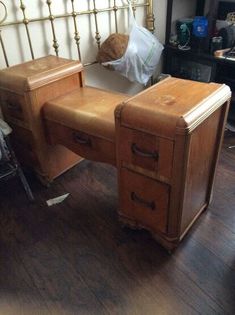 a wooden desk with two drawers and a teddy bear on top