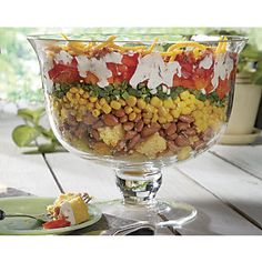 a glass bowl filled with lots of food