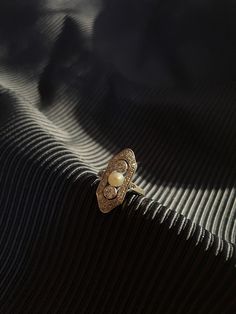 We imagine this sweet ring perched on the finger of a lady who intently watched the world evolve 100 years ago. And what better moment to give it a second life than now, a time where we are undoubtedly amidst another cultural and spiritual awakening. Approximately .9 carats of twinkly old diamonds are framed by milgrain, a characteristic of much of the jewelry that came out of the Edwardian Era. It is made of platinum-topped gold, which is the way they did things back in those days, all by hand Timeless Gold Opal Ring For Anniversary, Timeless Marquise Sterling Silver Ring, Heirloom 14k Gold Crystal Open Ring, Heirloom 14k Gold Crystal Promise Ring, Victorian Gold Sterling Silver Rings, Classic Pearl Promise Ring, Timeless Jewelry With Intricate Design For Anniversary, Victorian Gold Rings In Sterling Silver, Timeless Sterling Silver Moonstone Ring