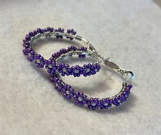 Purple Flower seed bead earrings. About 1.25in diameter hoop earrings. Cheap Purple Hoop Jewelry, Elegant Cheap Purple Hoop Earrings, Cheap Small Purple Hoop Earrings, Flower Seed Bead, Beaded Flower Earrings, Earring Inspiration, Purple Daisy, Earrings Purple, Daisy Earrings