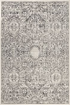 an area rug with black and white designs